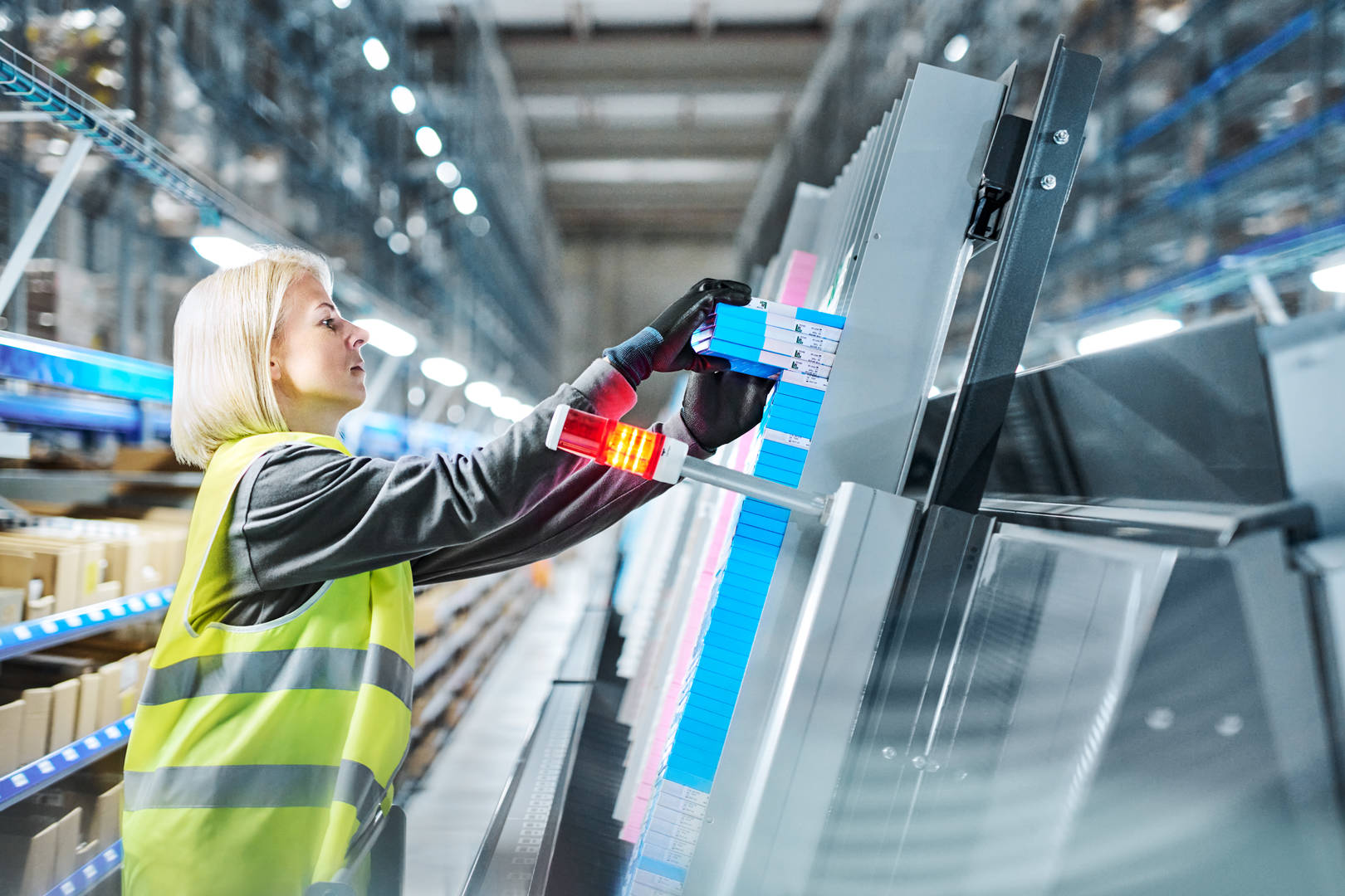 Cencora associate fulfilling pharmaceutical orders in a US distribution center.