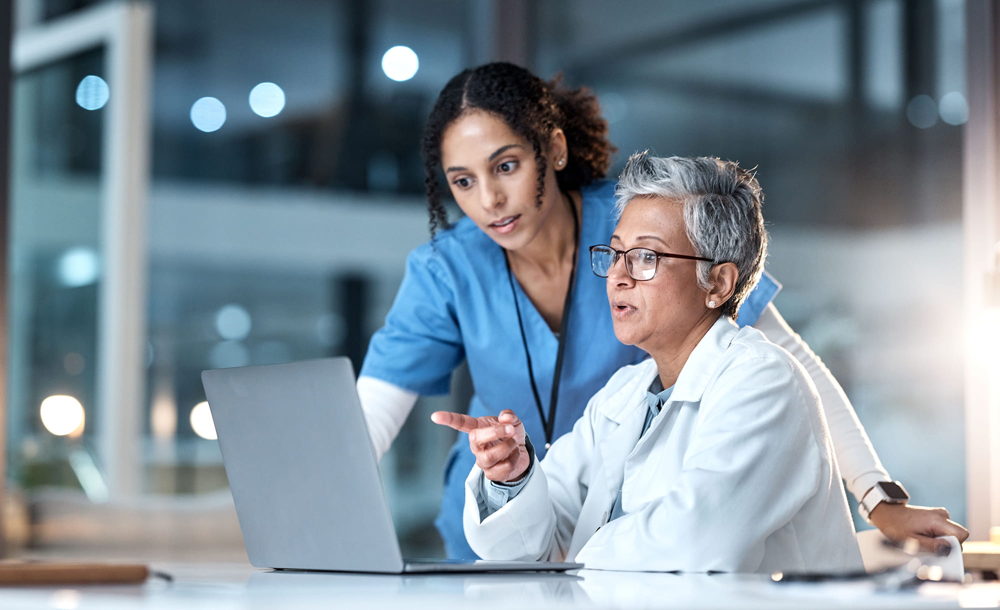 two women looking at computer
