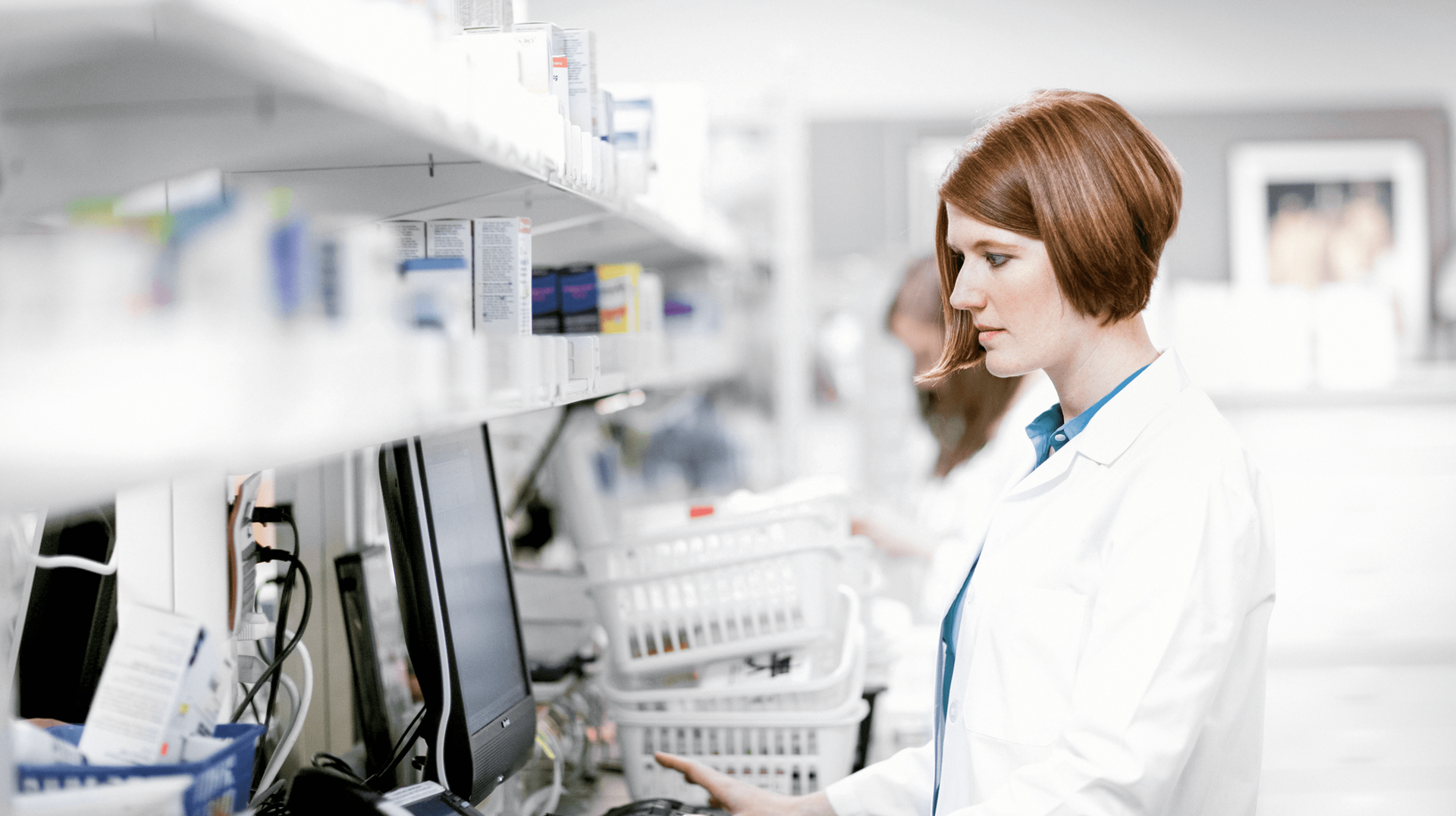 Pharmacist using a computer