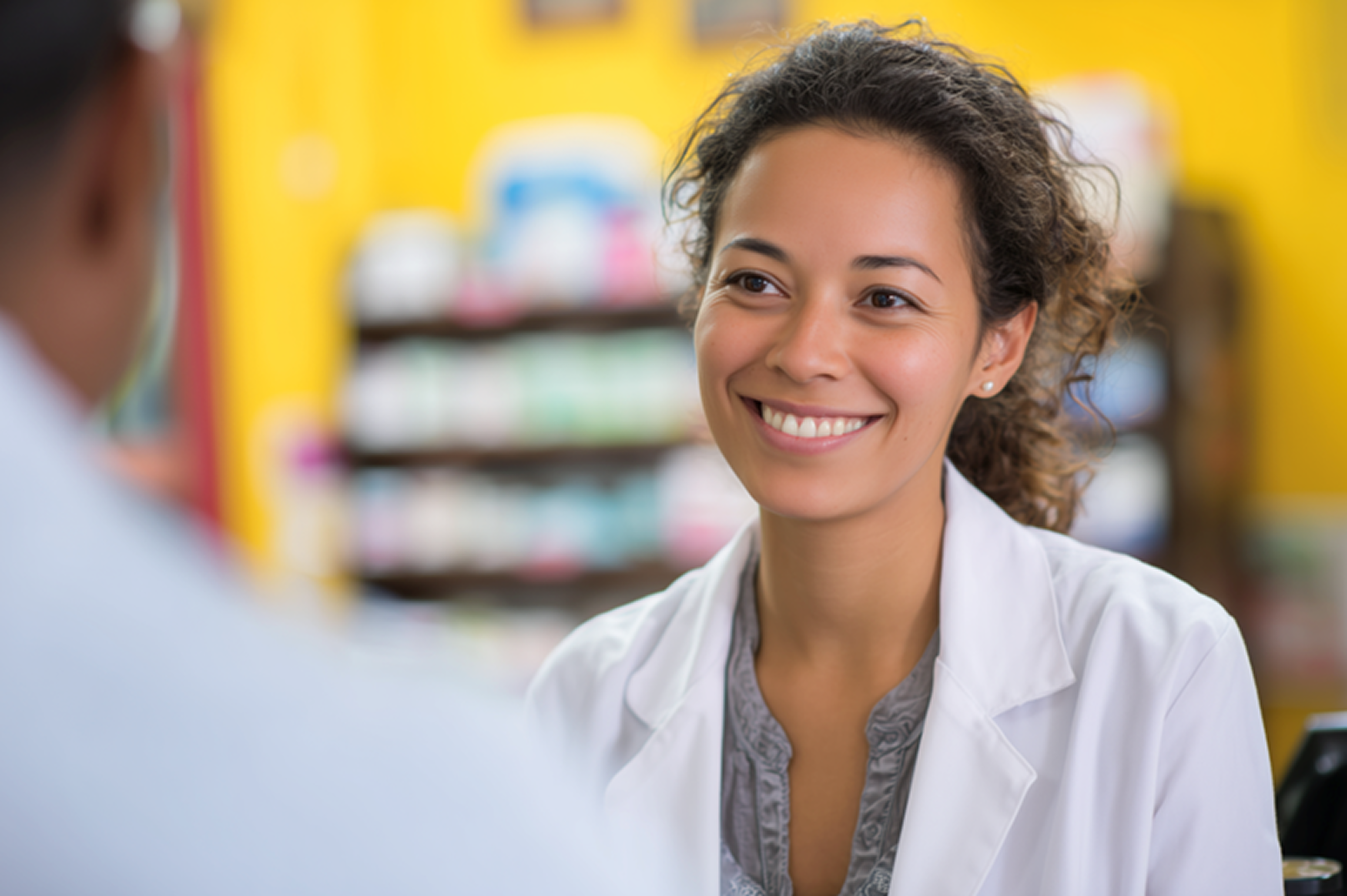 Smiling pharmacist consulting with a colleague