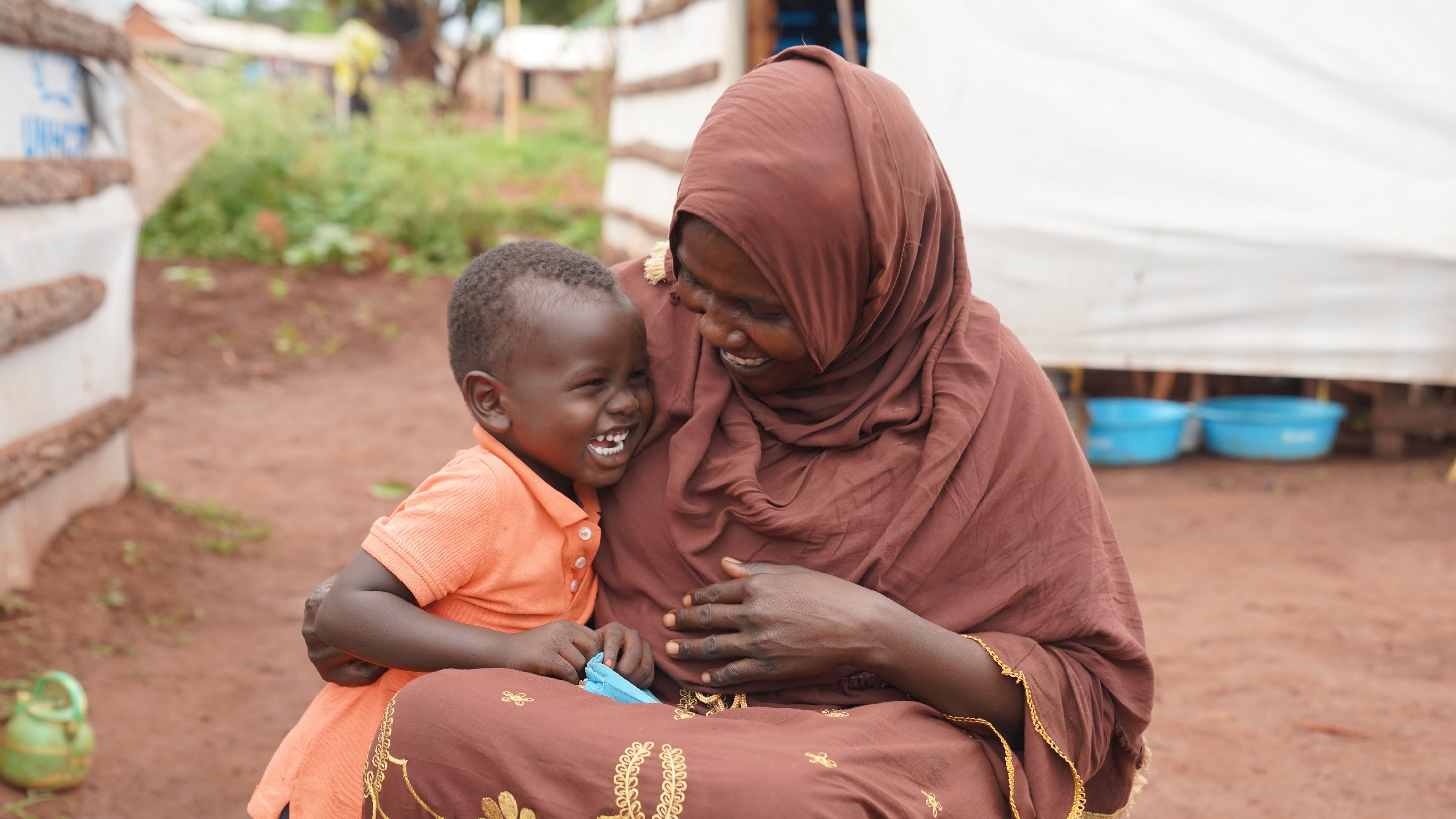 Mother and child hugging