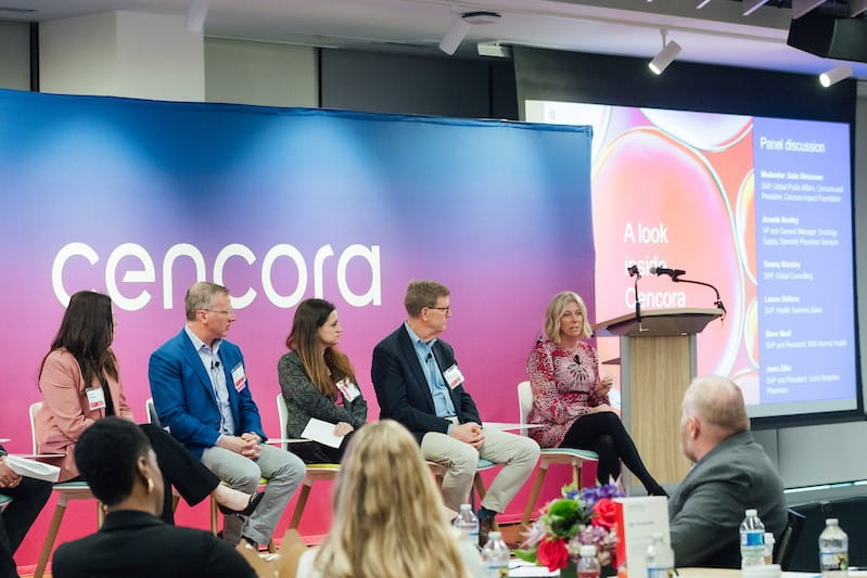 Conference setting, people talking on stage
