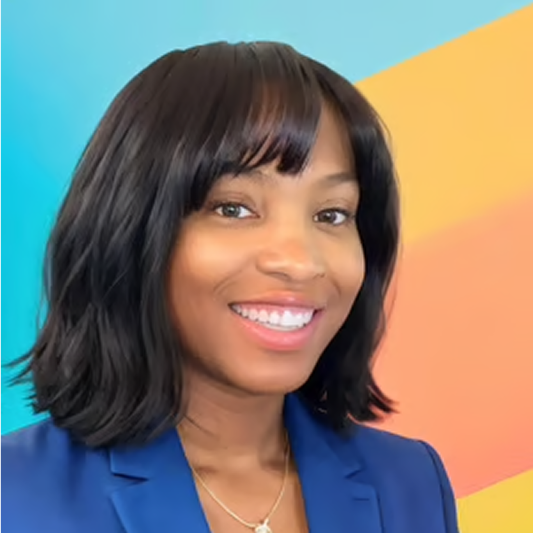  A confident headshot of a Clinical Pharmacy Services Director at Cencora, a young woman with short brown hair and a slight smile, dressed in a crisp blue blazer, conveying leadership and professionalism.