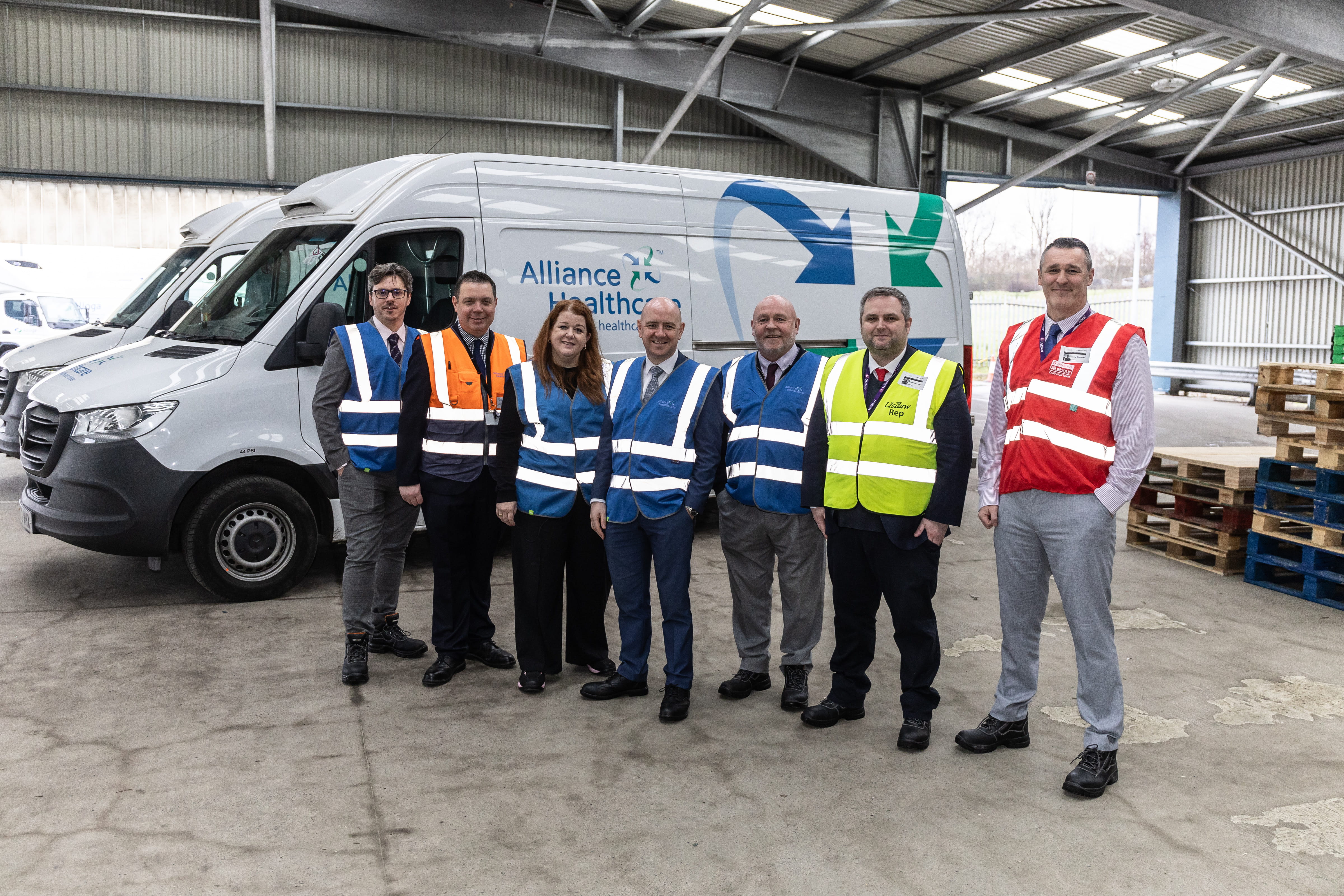 Frank McNally MP with the Alliance Healthcare team beside a delivery van at the Coatbridge Service Centre