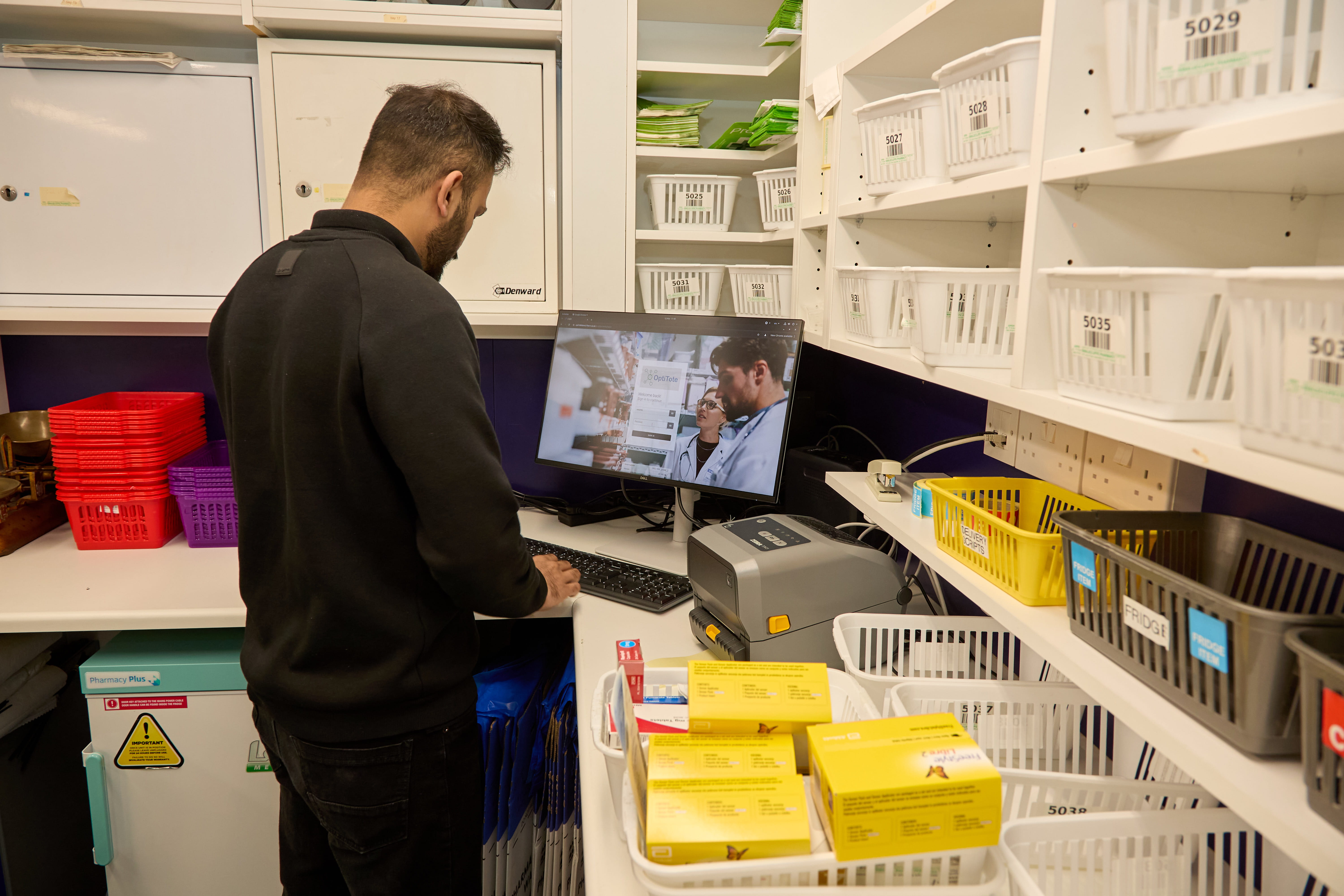 Pharmacy team using OptiTote at Swalecliffe Pharmacy, Kent