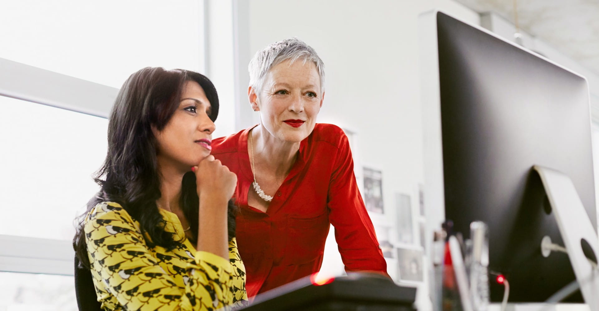 Business colleagues sharing a screen