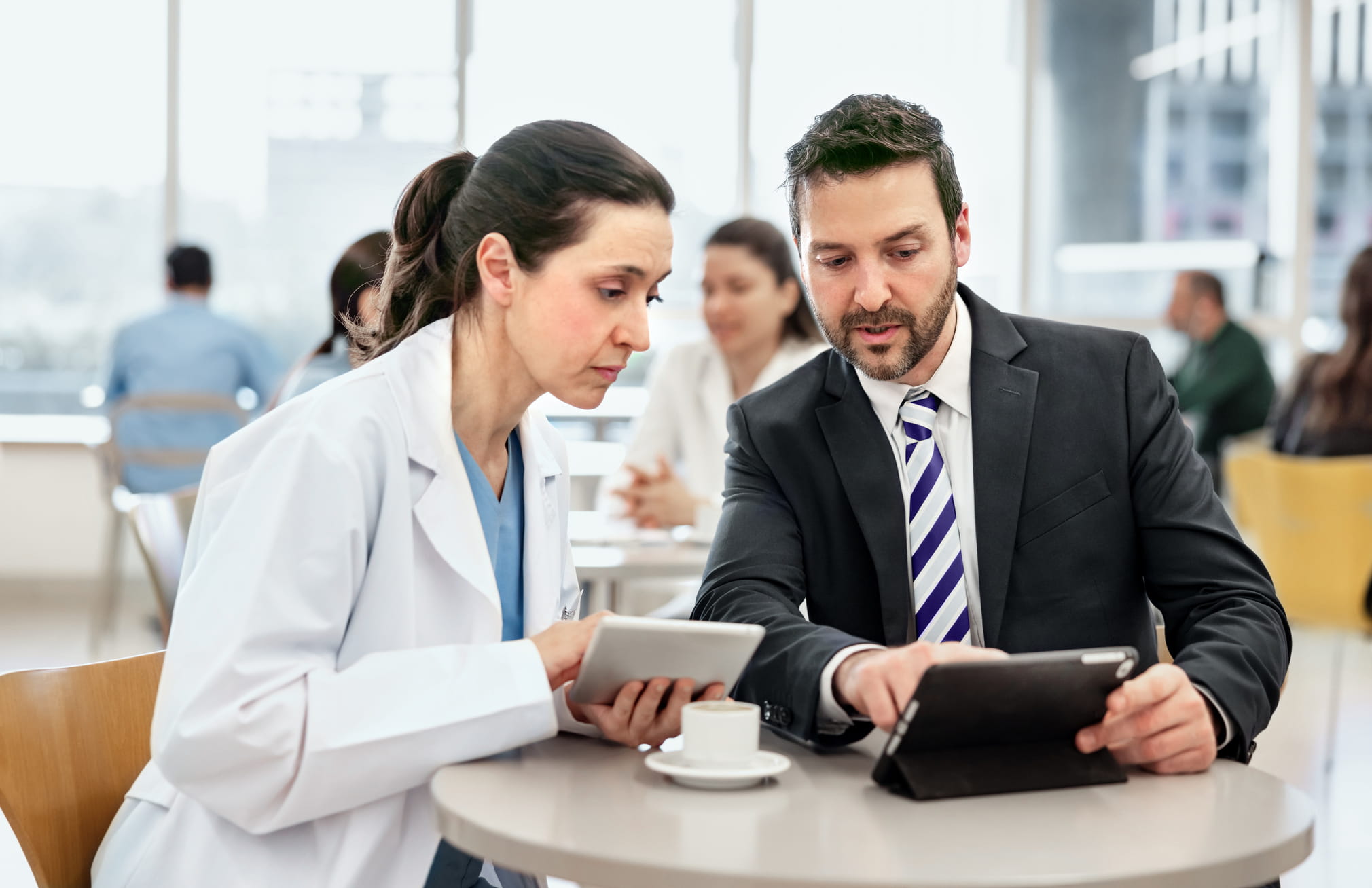 meeting between doctor and a business man at the lunch table