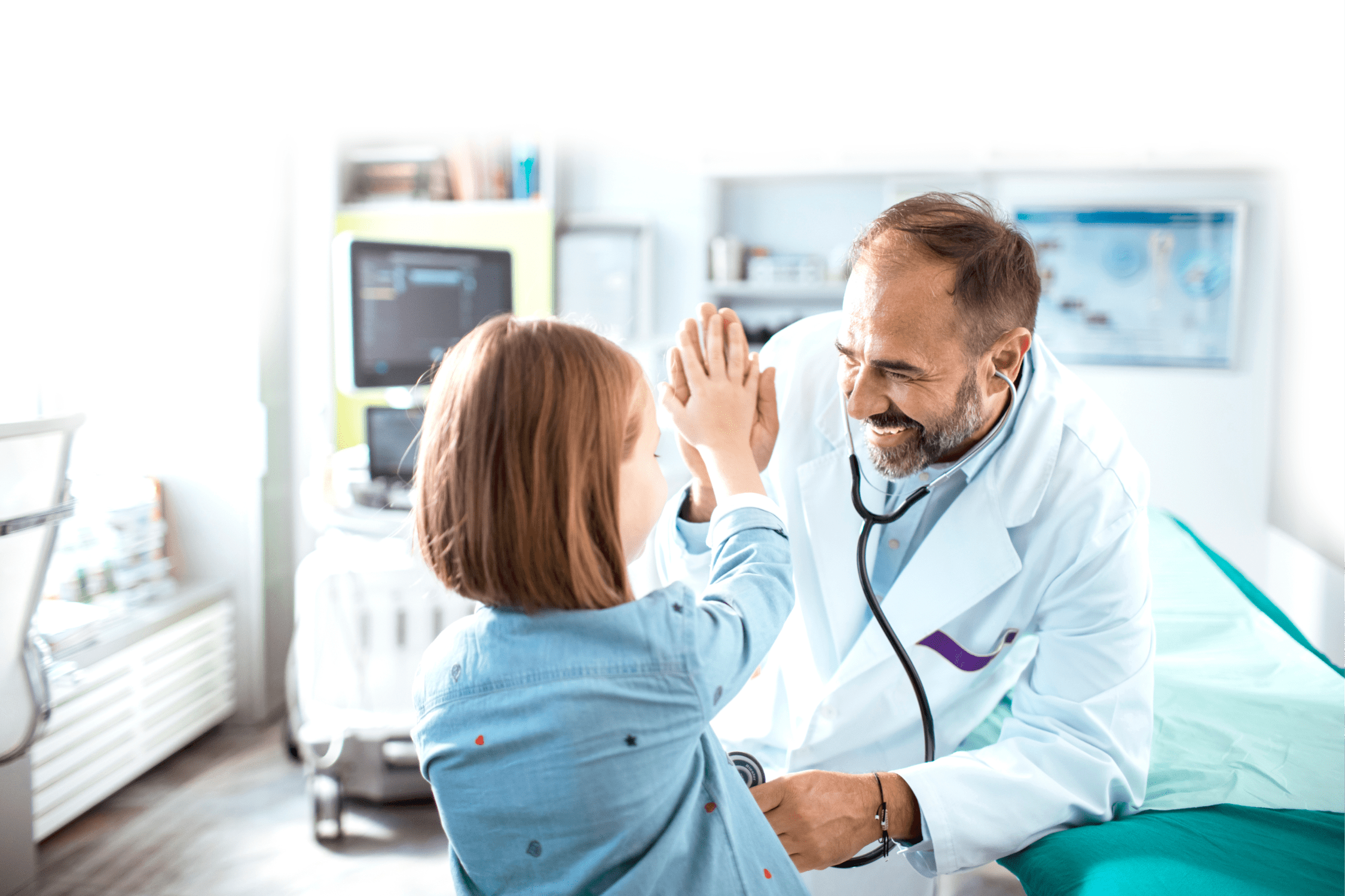 doctor giving high-five to a young patient