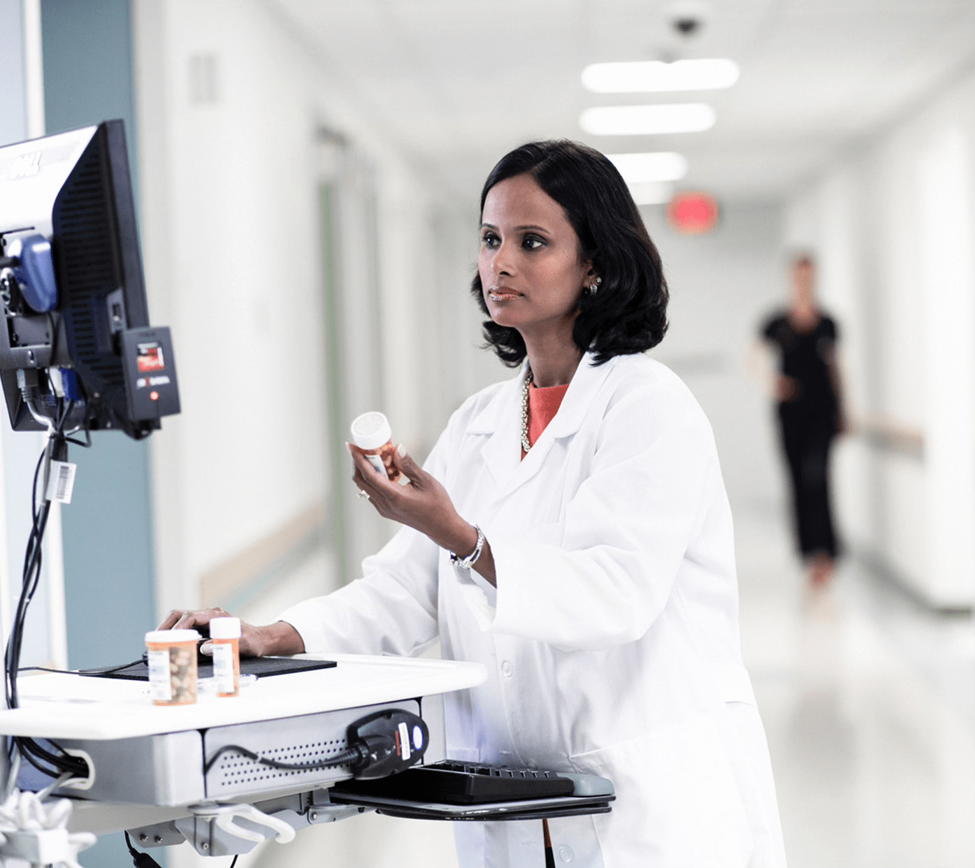 doctor checking medicines in the system