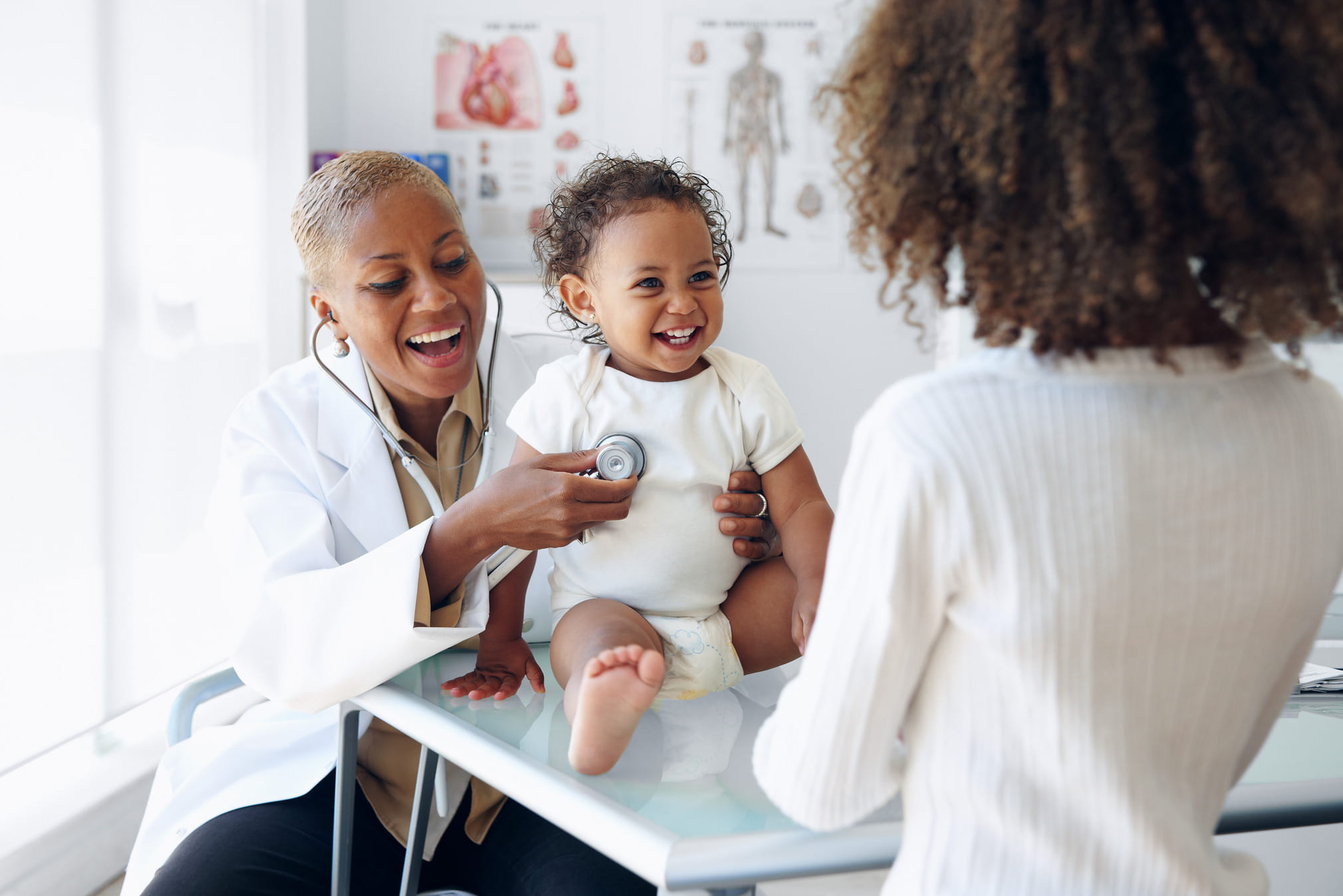 Care team supporting a child and family in a pediatric health system.