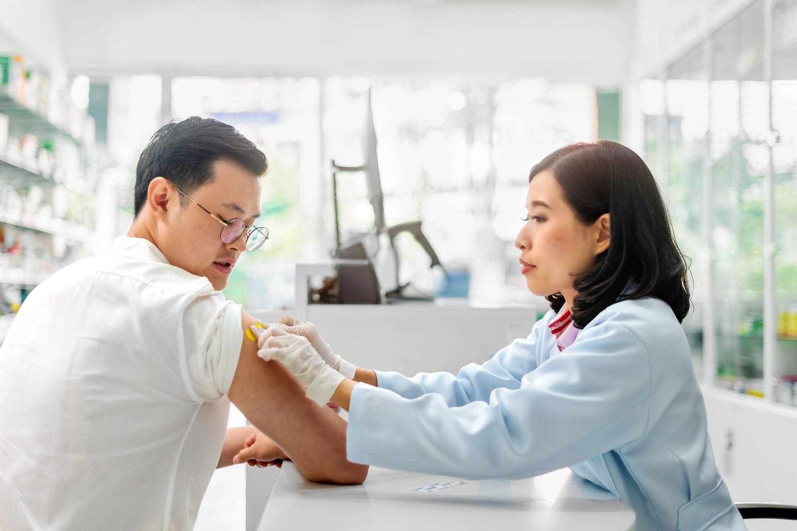 Nurse delivering a vaccine in-hospital.
